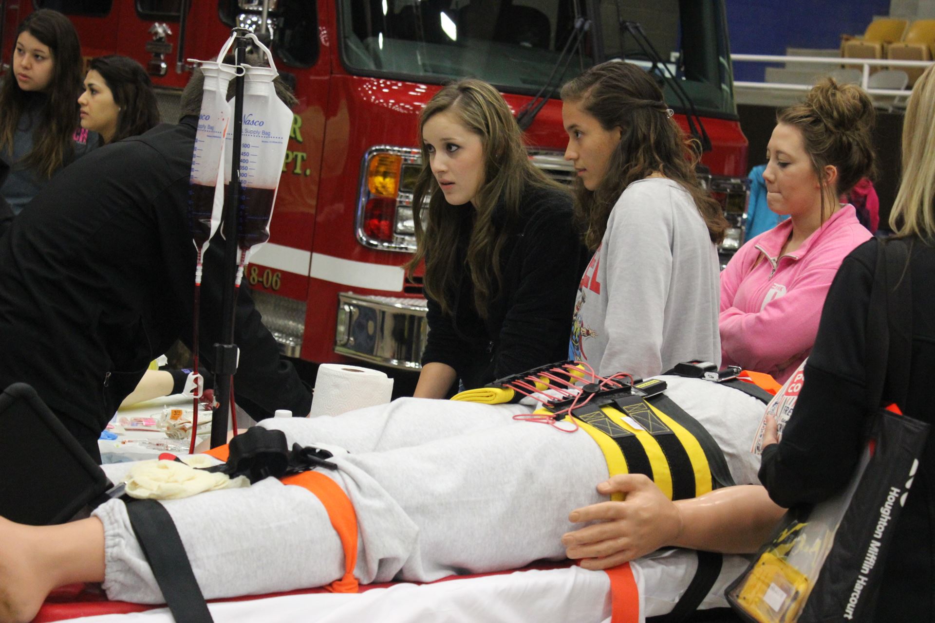 Students get training from EMS personnel.